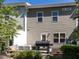 View of the back exterior of the house with grill and air conditioning unit at 6341 Grace Lily Dr, Raleigh, NC 27607