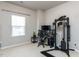 Bedroom featuring carpet, a large window, workout equipment, and a computer desk at 6341 Grace Lily Dr, Raleigh, NC 27607