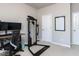Bedroom featuring carpet, a computer desk, workout equipment, and a white board at 6341 Grace Lily Dr, Raleigh, NC 27607