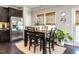 Bright breakfast nook features stainless steel appliances, natural light, and cozy dining area at 6341 Grace Lily Dr, Raleigh, NC 27607