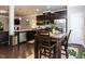Kitchen featuring dark wood floors, stainless steel appliances and wooden dining table at 6341 Grace Lily Dr, Raleigh, NC 27607