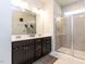 Modern main bathroom with double vanity, tiled shower, and sleek fixtures at 6341 Grace Lily Dr, Raleigh, NC 27607