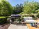 Patio with comfortable seating, grill, and natural views at 6341 Grace Lily Dr, Raleigh, NC 27607