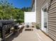 Outdoor patio featuring modern grill, comfortable seating, and natural surroundings at 6341 Grace Lily Dr, Raleigh, NC 27607