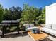 Patio with comfortable seating, grill, and natural views at 6341 Grace Lily Dr, Raleigh, NC 27607