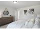 Inviting bedroom with a textured dresser, decorative mirror, and soothing wall art at 680 Beacon Hill Rd # 52, Lillington, NC 27546