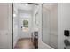 Bright entryway with modern wainscoting, wood-look floors, and a front door with glass inserts at 680 Beacon Hill Rd # 52, Lillington, NC 27546