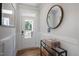 Bright entryway with modern wainscoting, wood-look floors, and a front door with glass inserts at 680 Beacon Hill Rd # 52, Lillington, NC 27546