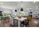 Beautiful eat-in kitchen boasts an island, stainless appliances, and living room view at 680 Beacon Hill Rd # 52, Lillington, NC 27546