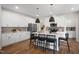 Charming eat-in kitchen features an island, stainless appliances, and pendant lighting at 680 Beacon Hill Rd # 52, Lillington, NC 27546