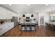 Bright eat-in kitchen features an island, stainless appliances, and pendant lighting at 680 Beacon Hill Rd # 52, Lillington, NC 27546