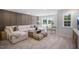 Comfortable living room showcasing a plush sectional sofa, cozy ottomans, and modern decor, ideal for relaxation at 680 Beacon Hill Rd # 52, Lillington, NC 27546