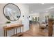 Open concept living room with hardwood floors, staircase, and natural light from the many windows at 680 Beacon Hill Rd # 52, Lillington, NC 27546