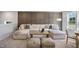 Inviting living room featuring a comfortable sectional sofa, stylish decor, and ample natural light from the windows at 680 Beacon Hill Rd # 52, Lillington, NC 27546