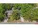 An aerial view of the home in a lush, tree-filled neighborhood at 806 Martin Luther King Jr Dr, Smithfield, NC 27577