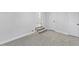 Basement area with stairs, grey carpet and white walls at 806 Martin Luther King Jr Dr, Smithfield, NC 27577