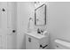 Modern bathroom with vanity, neutral colors and white fixtures at 806 Martin Luther King Jr Dr, Smithfield, NC 27577