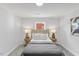 This is a light and airy bedroom with a neutral palette and comfortable furnishings at 806 Martin Luther King Jr Dr, Smithfield, NC 27577