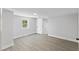 Spacious bedroom with light gray walls, wood-look flooring, and a window at 806 Martin Luther King Jr Dr, Smithfield, NC 27577