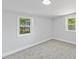Bright bedroom featuring two windows and neutral decor at 806 Martin Luther King Jr Dr, Smithfield, NC 27577