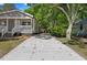 Long driveway leading to a gray house surrounded by lush greenery at 806 Martin Luther King Jr Dr, Smithfield, NC 27577