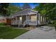 Charming gray home with a welcoming front porch and well-maintained lawn at 806 Martin Luther King Jr Dr, Smithfield, NC 27577