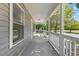 Inviting front porch with white railings and a view of the street at 806 Martin Luther King Jr Dr, Smithfield, NC 27577