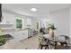 Open concept kitchen with granite counters, white cabinets and stainless appliances at 806 Martin Luther King Jr Dr, Smithfield, NC 27577