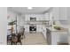 Modern kitchen boasts white cabinetry, granite countertops, and stainless steel appliances at 806 Martin Luther King Jr Dr, Smithfield, NC 27577