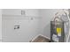 Compact utility room showcasing water heater and wire shelving at 806 Martin Luther King Jr Dr, Smithfield, NC 27577