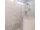 Modern bathroom featuring tiled shower with glass door and rainfall shower head at 816 Still Willow Ln, Wendell, NC 27591