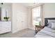 Digitally staged bedroom with carpet, window with curtains, and double door closet for storage at 816 Still Willow Ln, Wendell, NC 27591