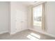 Bedroom with carpet, window with curtains, and double door closet for storage at 816 Still Willow Ln, Wendell, NC 27591