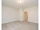 Empty bedroom with carpet, neutral paint, and bathroom doorway at 816 Still Willow Ln, Wendell, NC 27591