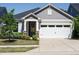 Charming gray house with a two-car garage and manicured landscaping, creating excellent curb appeal at 816 Still Willow Ln, Wendell, NC 27591
