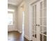 Bright foyer with hardwood floors and glass French doors at 816 Still Willow Ln, Wendell, NC 27591