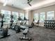 Well-equipped community gym with treadmills, elliptical machines, weights, and natural light from large windows at 816 Still Willow Ln, Wendell, NC 27591