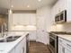 Kitchen featuring granite countertops, stainless steel appliances, and sleek cabinetry at 816 Still Willow Ln, Wendell, NC 27591