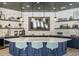 Stylish community kitchen area with a large island, white marble countertops, and custom cabinetry at 816 Still Willow Ln, Wendell, NC 27591