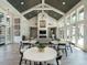 Inviting community lounge with vaulted ceilings, fireplace, artwork, and ample seating for residents at 816 Still Willow Ln, Wendell, NC 27591