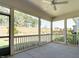 Covered back porch with ceiling fan overlooking the backyard, perfect for outdoor entertaining at 816 Still Willow Ln, Wendell, NC 27591