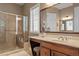 Bathroom featuring a glass shower and vanity with large mirror at 913 S South Bend Dr, Durham, NC 27713