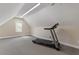 Spacious bonus room featuring a treadmill, carpet and bright natural light at 913 S South Bend Dr, Durham, NC 27713