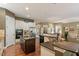 Large kitchen featuring granite countertops, stainless appliances, and hardwood flooring at 913 S South Bend Dr, Durham, NC 27713