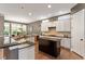 Spacious kitchen with granite countertops, island, and stainless appliances at 913 S South Bend Dr, Durham, NC 27713