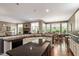 A view of the kitchen with an eating area and stone fireplace at 913 S South Bend Dr, Durham, NC 27713