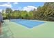 Well-maintained tennis court with professional surfacing and net, providing an excellent recreational amenity at 913 S South Bend Dr, Durham, NC 27713