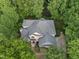 A bird's-eye view reveals a well-maintained home nestled among lush trees with ample privacy at 927 Jones Wynd, Wake Forest, NC 27587