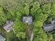 Aerial view of the house nestled among mature trees, showcasing its private setting at 927 Jones Wynd, Wake Forest, NC 27587