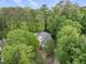 Secluded home nestled in lush greenery with mature trees in a private residential neighborhood at 927 Jones Wynd, Wake Forest, NC 27587